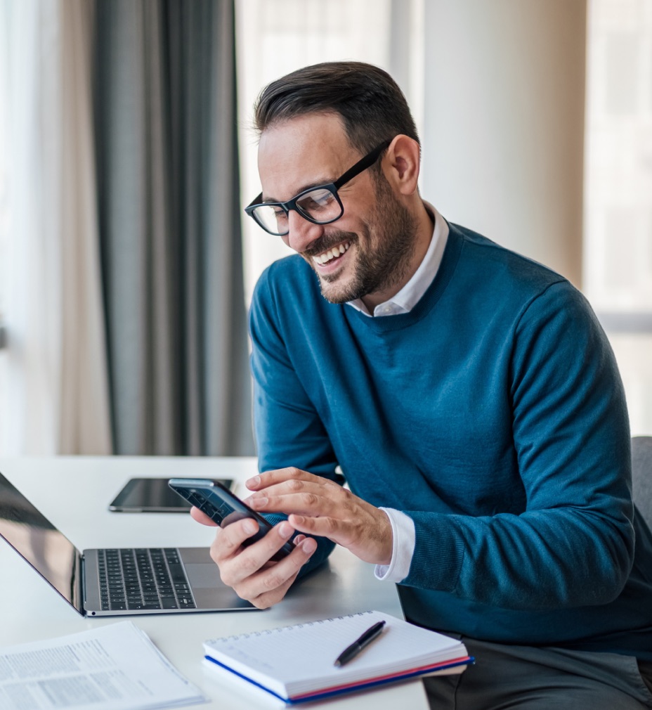 Smiling professional using smartphone - Five9 cloud contact center customer engagement