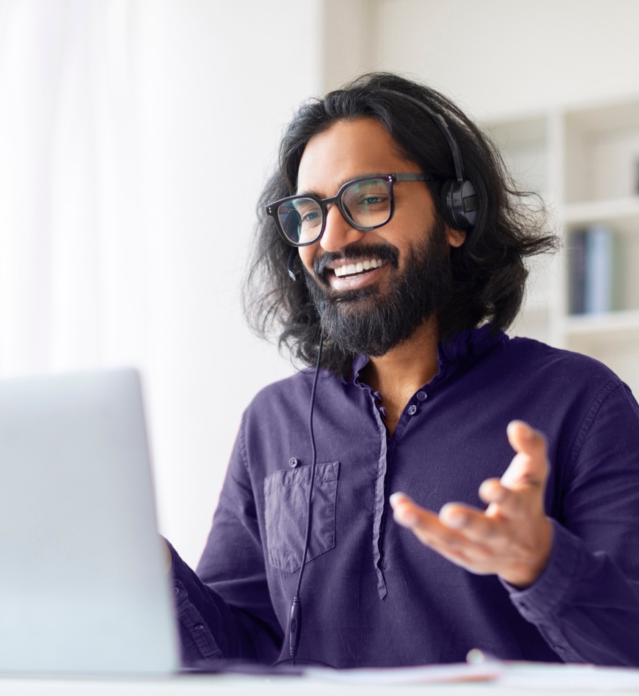 Professional at desk with laptop - RingCentral unified cloud communications